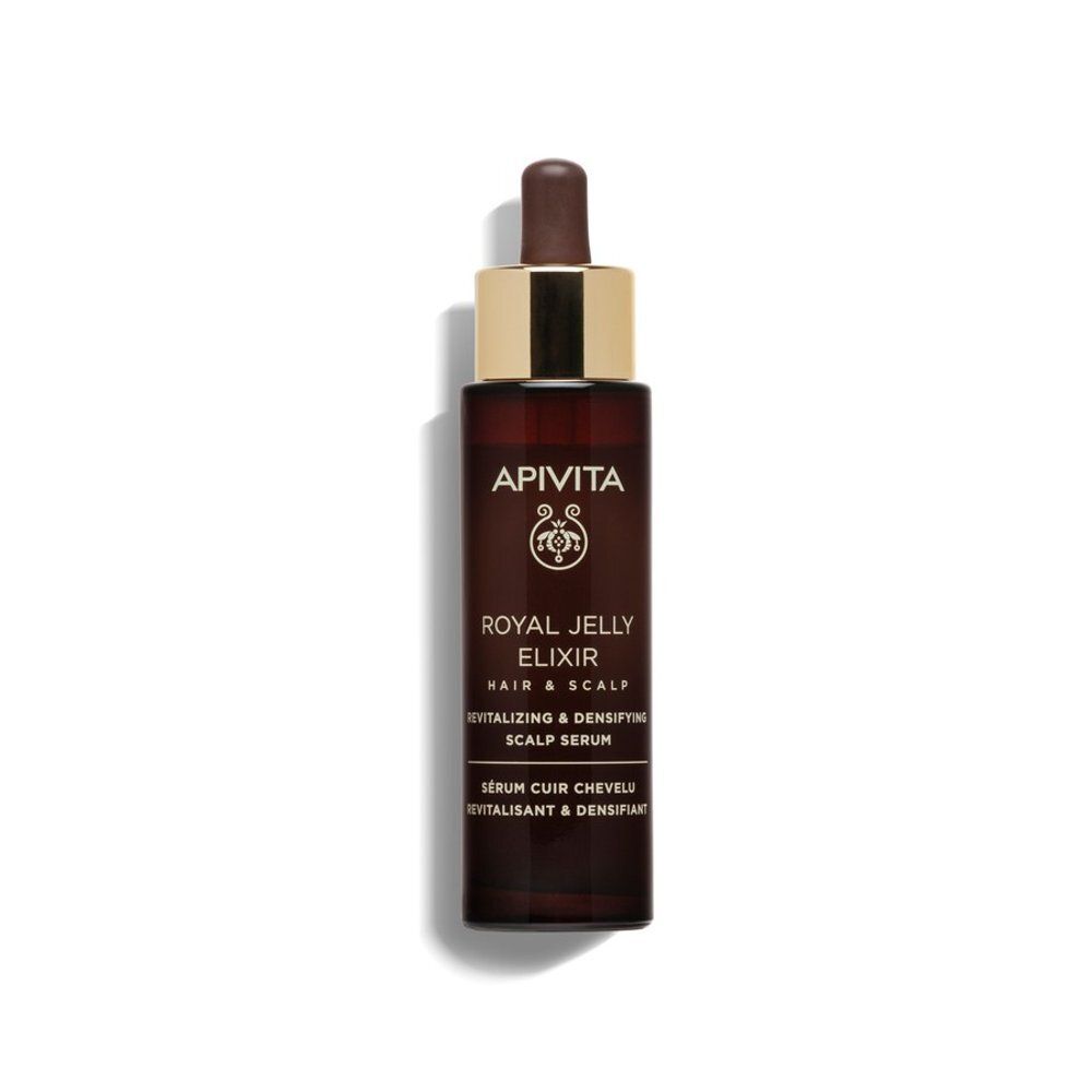 Flacon brun avec bouchon doré et pipette. Inscription : Apivita Royal Jelly Elixir. Sérum revitalisant pour le cuir chevelu.