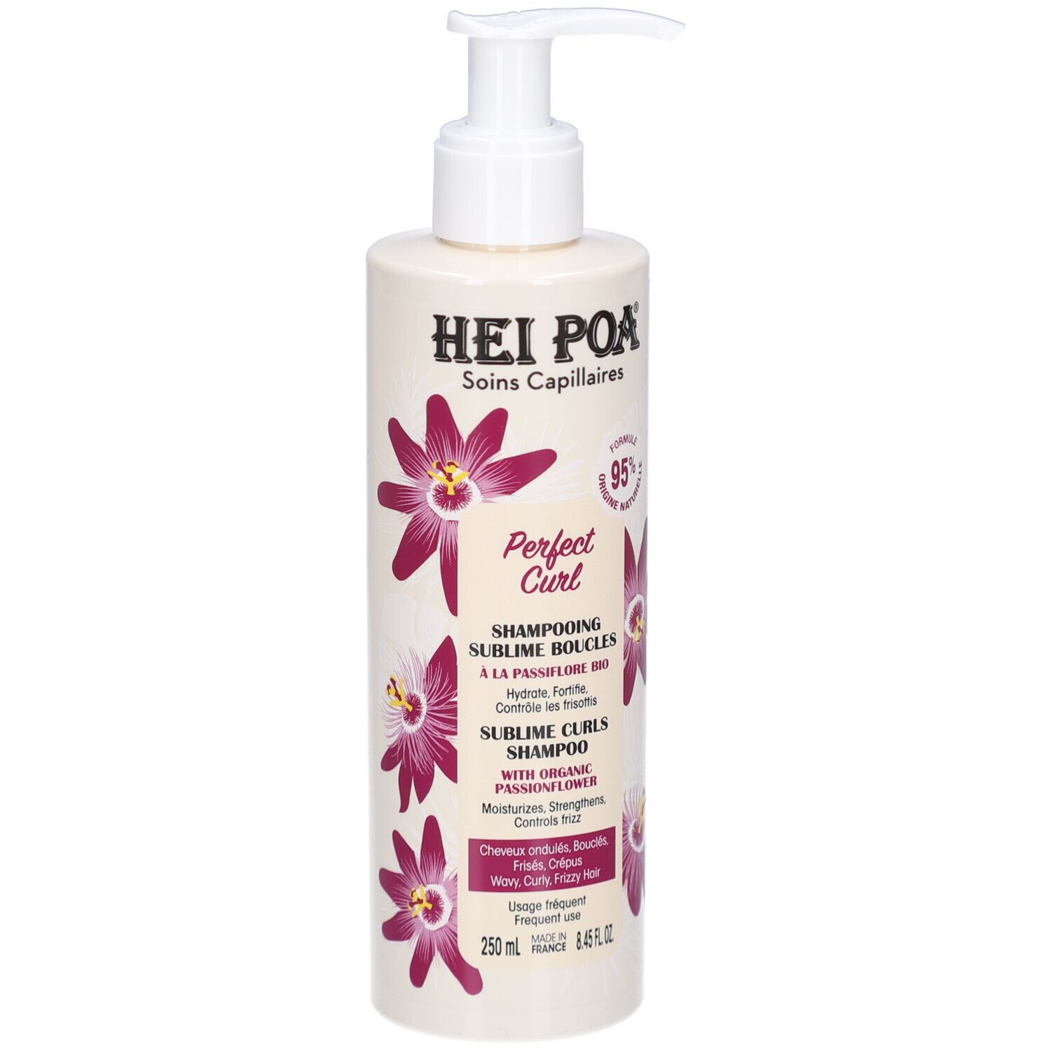 Flacon de shampooing avec pompe. Inscriptions: Hei Poa, Perfect Curl, Sublime Boucles, 250ml. Décoré de fleurs violettes.