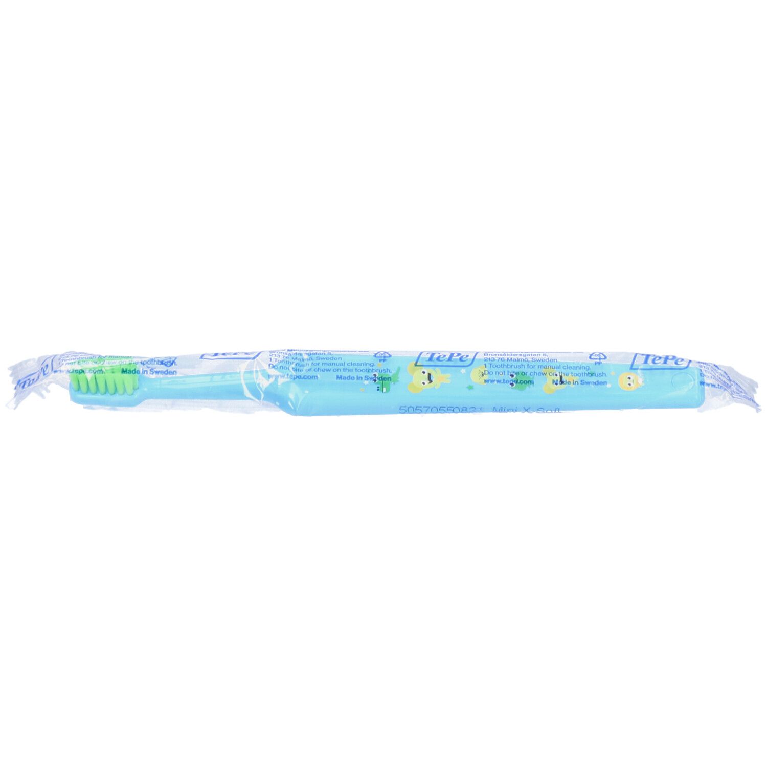 Brosse à dents emballée. Manche bleu clair, tête verte. Emballage avec texte et logo.