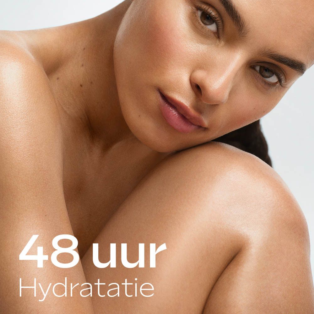 Close-up van duindoornolie en vitamine C. Tekst: 100% ingrediënten van natuurlijke oorsprong.