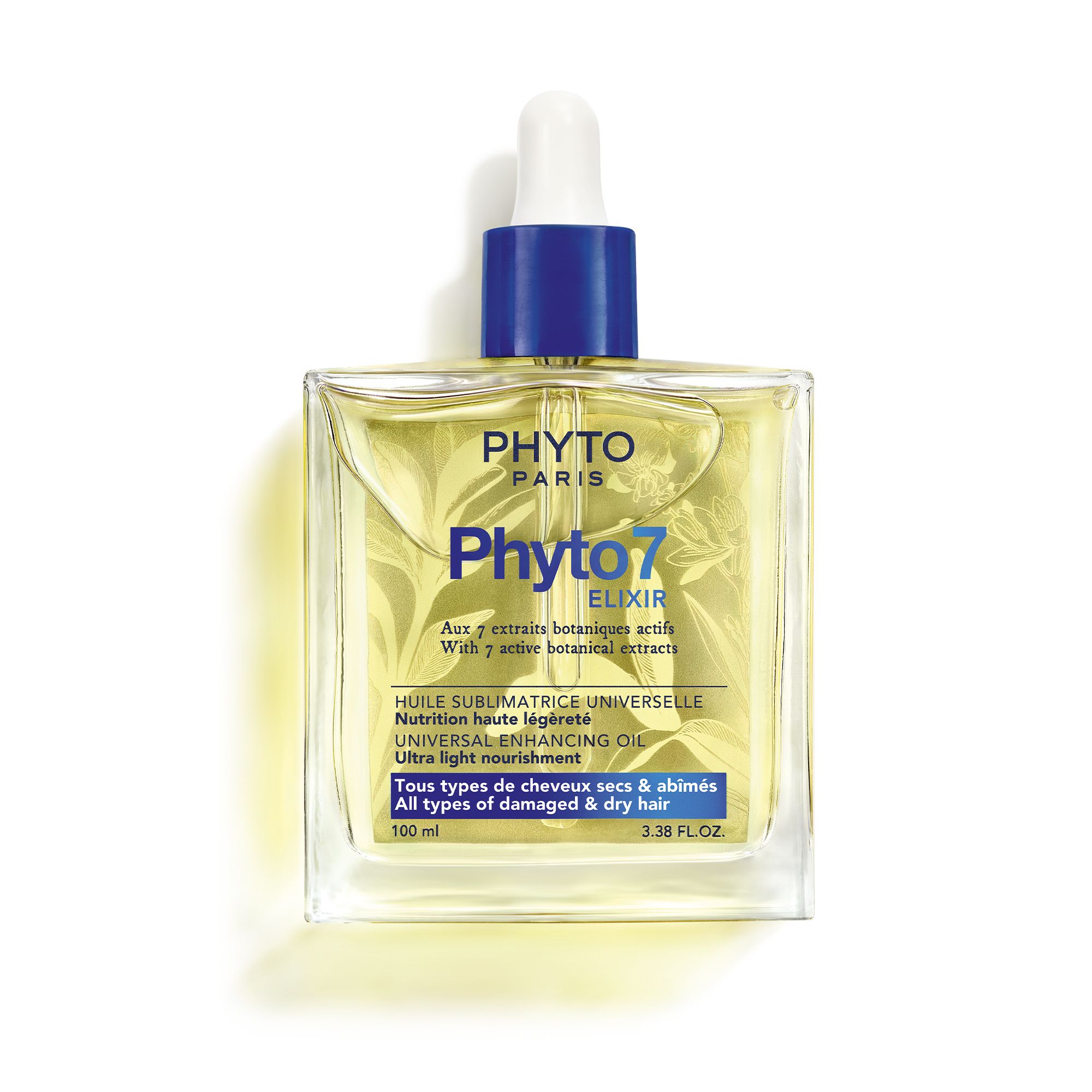Vierkante glazen fles met gele vloeistof. Blauwe dop met pipet. Opschrift: Phyto Paris, Phyto7 Elixir.