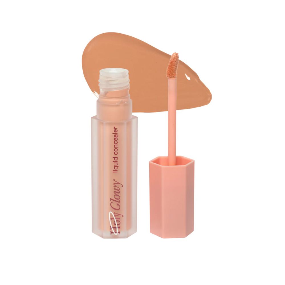 Correcteur liquide avec applicateur et échantillon de couleur. Le correcteur est dans un flacon transparent avec un bouchon rose.