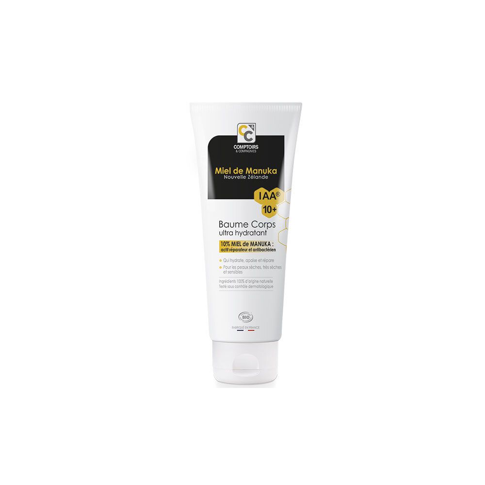 Witte tube met zwart etiket. Tekst: Miel de Manuka, IAA 10+, Baume Corps ultra hydratant. Bio-label.