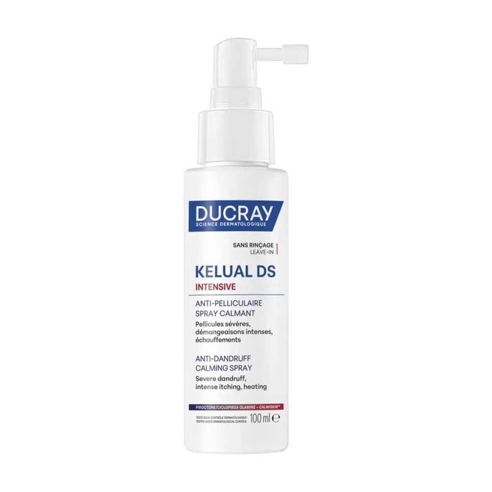 Spray Ducray Kelual DS Intensive. Flacon blanc avec vaporisateur. Nom du produit et texte en bleu et blanc.