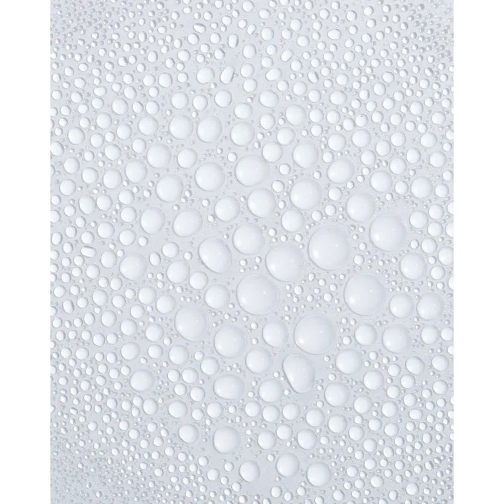 Ducray Kelual DS Intensive spray. Witte fles met sproeikop. Productnaam en tekst in blauw en wit.