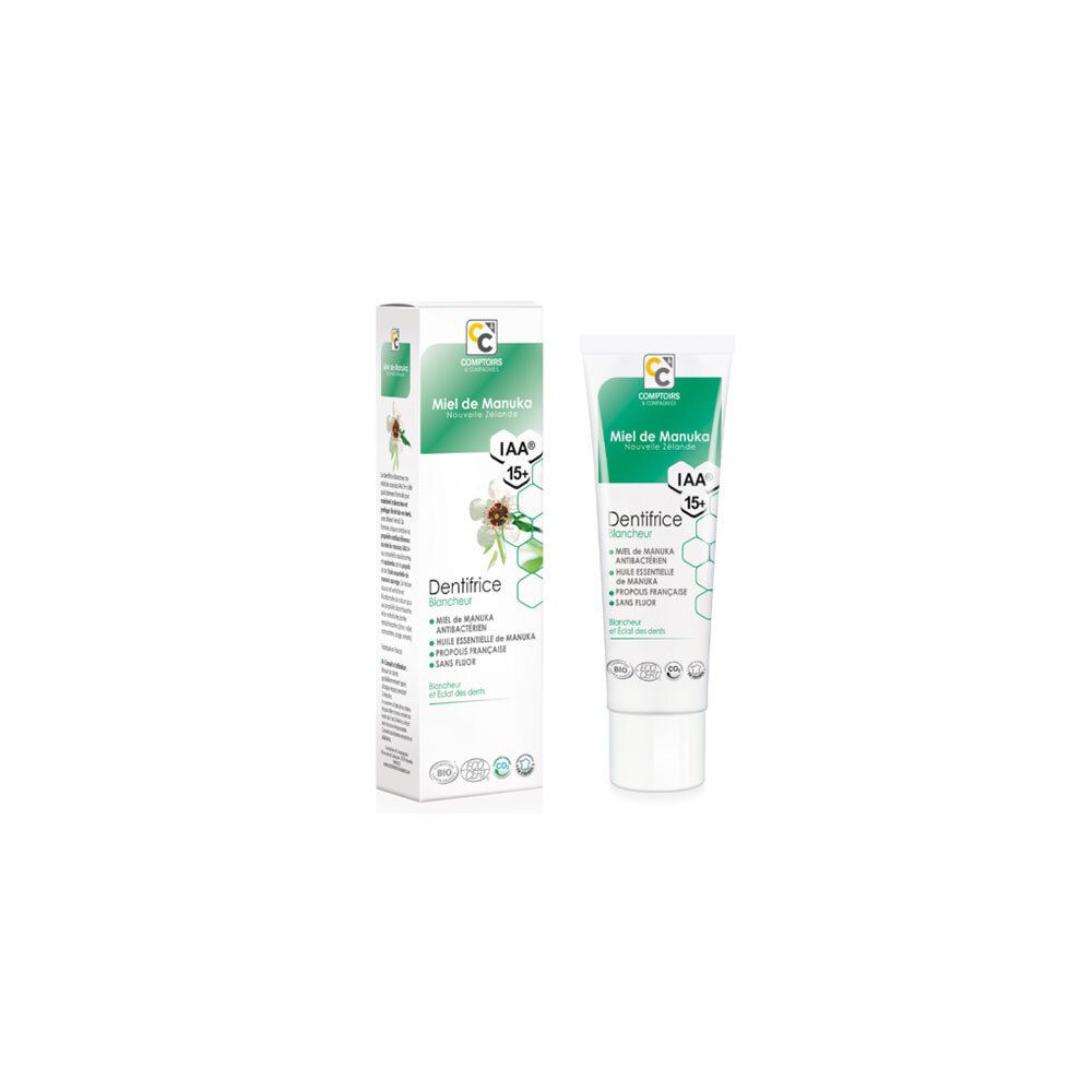 Tandpasta tube en doos. Wit, groen. Tekst: Miel de Manuka, Dentifrice Blancheur, IAA 15+. Logo Comptoirs & Compagnies.