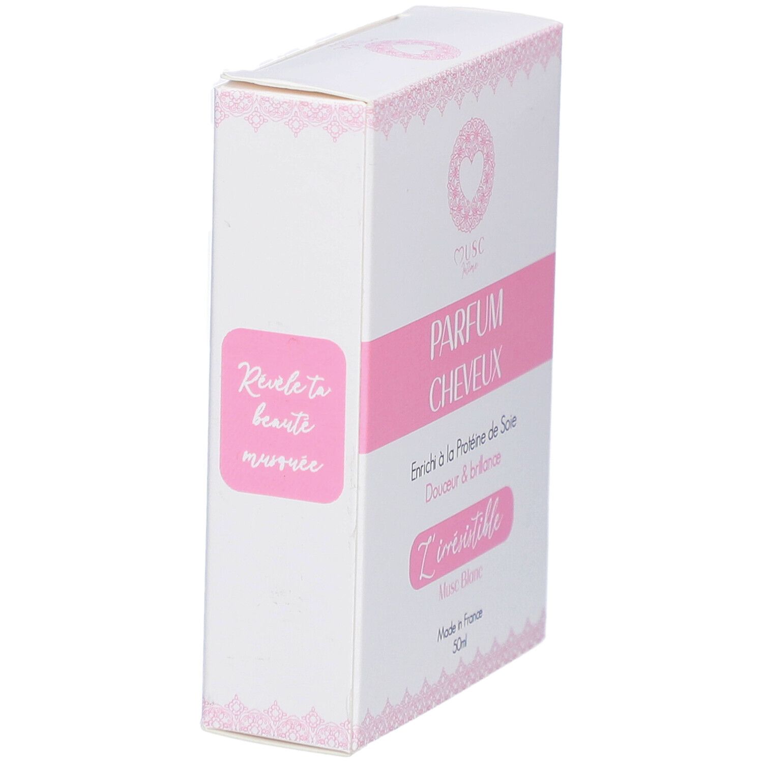 Witte doos met roze accenten. Tekst: PARFUM CHEVEUX, L'irrésistible, Musc Blanc, Made in France, 30ml.