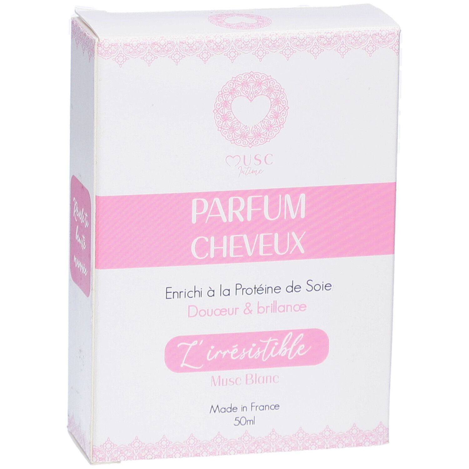 Witte doos met roze accenten. Tekst: PARFUM CHEVEUX, L'irrésistible, Musc Blanc, Made in France, 50ml.