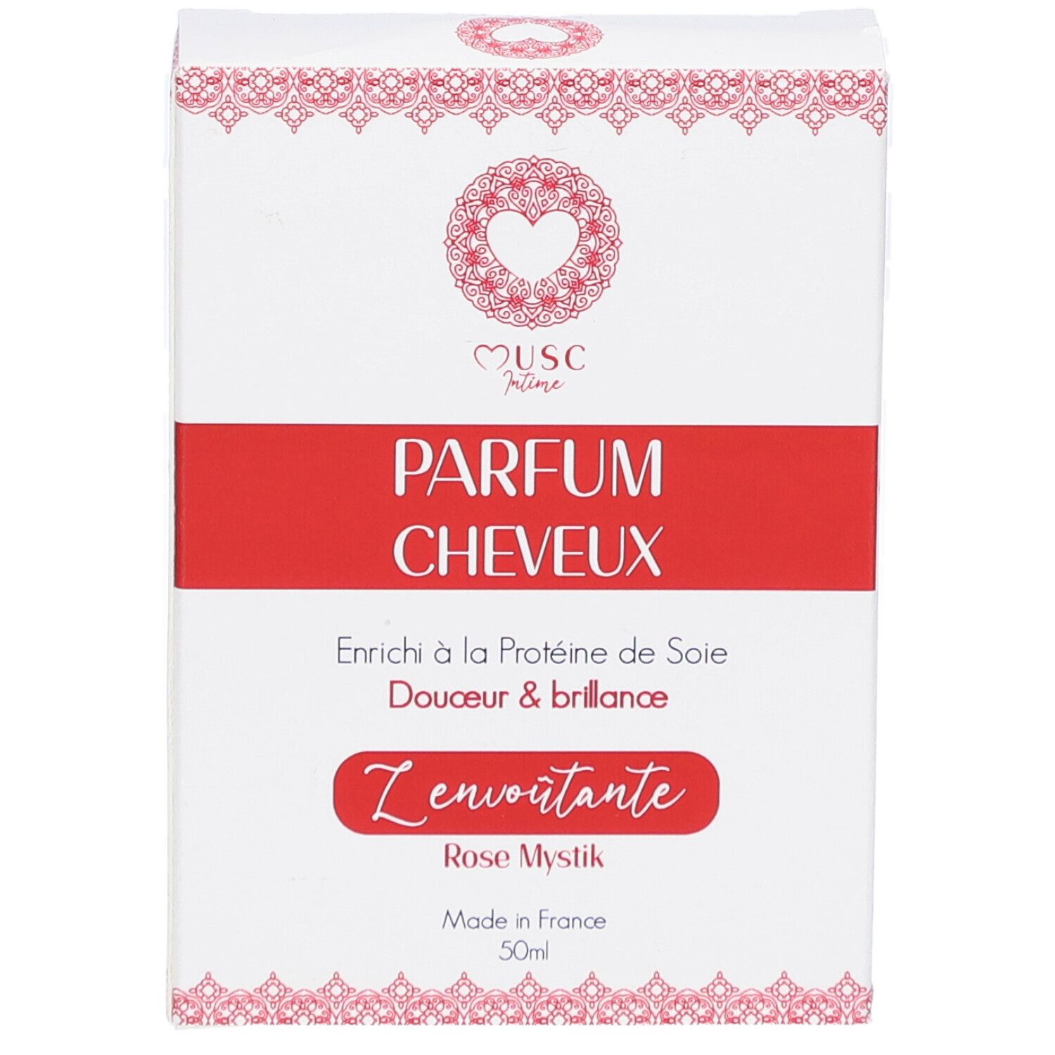 Witte doos met rode band. Opschrift: PARFUM CHEVEUX, Z'envoutante, Rose Mystik. Hart logo. Made in France.