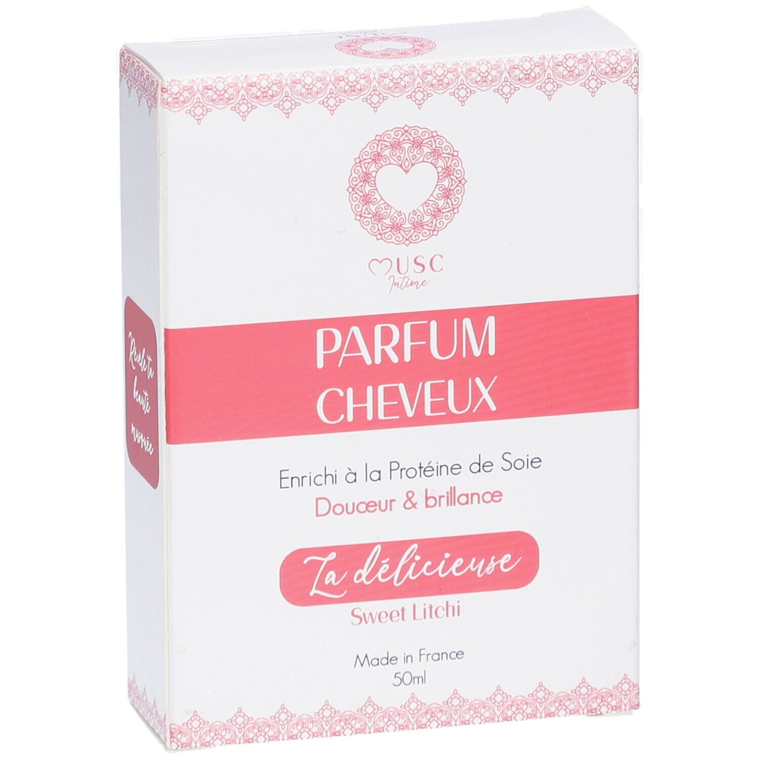 Witte doos met roze accenten. Tekst: "Musc Intime Parfum Cheveux". "La délicieuse Sweet Litchi". Gemaakt in Frankrijk. 50ml.