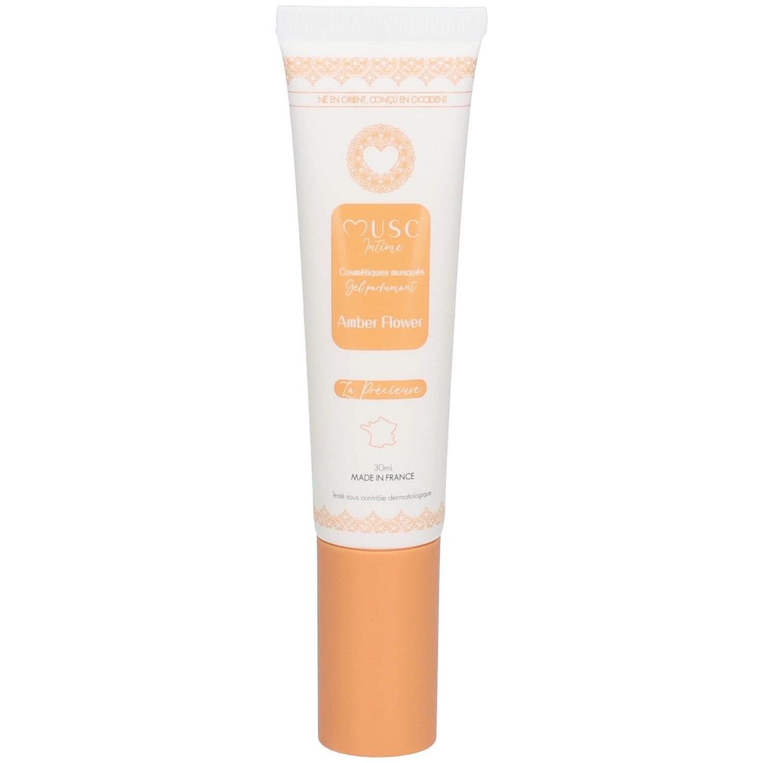 Tube blanc avec bouchon orange, inscription "MUSC Nuit Amber Flower".