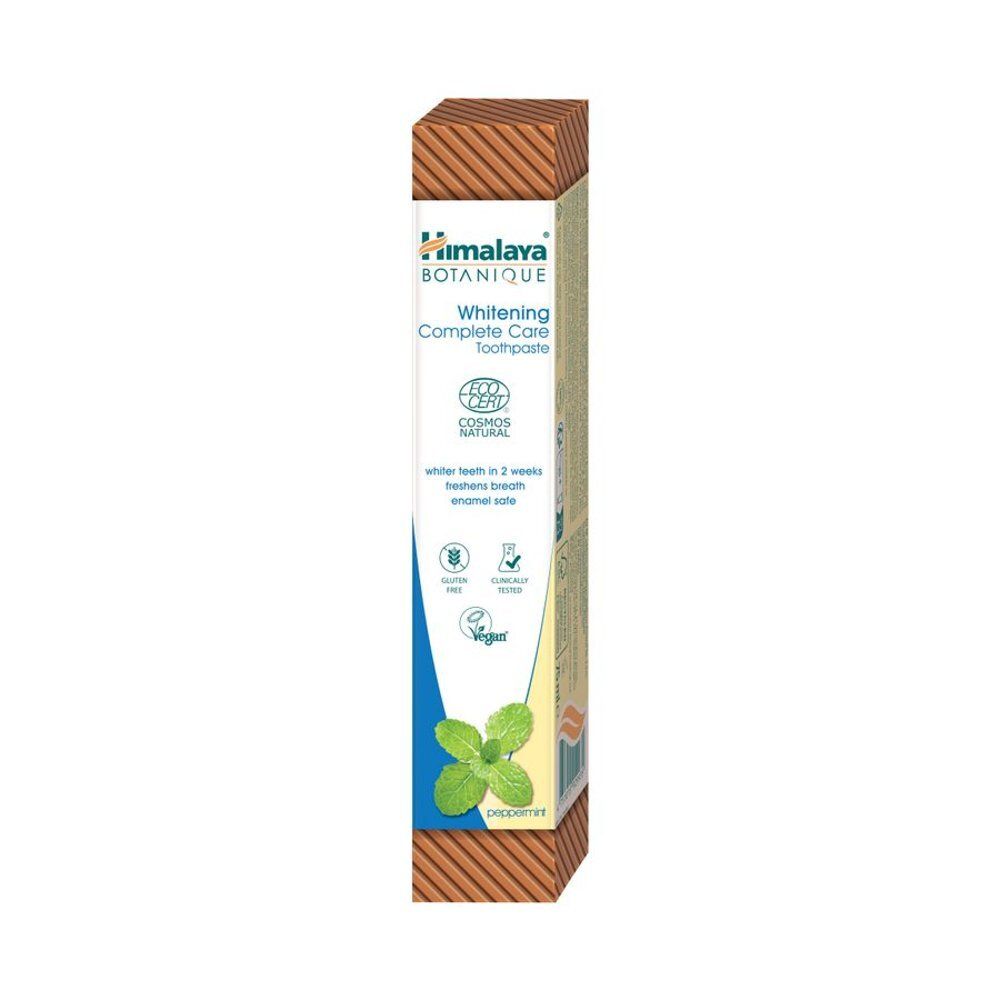 Kartonnen verpakking voor tandpasta. Opschrift: Himalaya Botanique, Whitening Complete Care. Groen-wit design.