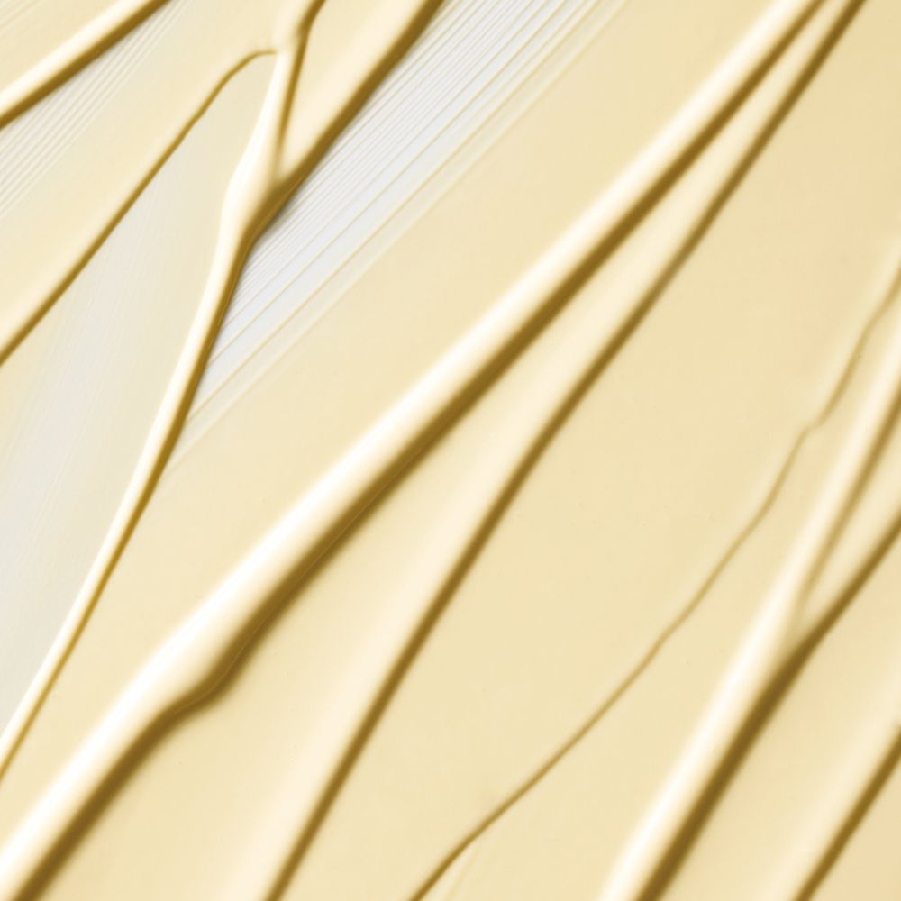 Close-up van crèmekleurige strepen. Textuur van Clinique Dramatically Different Moisturizing Lotion.