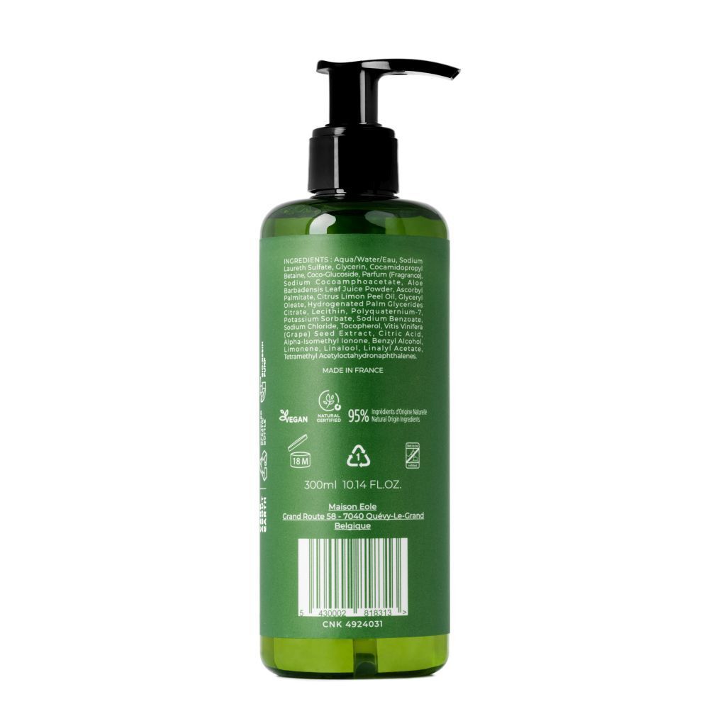 Dos du flacon vert avec texte et code-barres. Logo Vegan, 95% ingrédients d'origine naturelle.