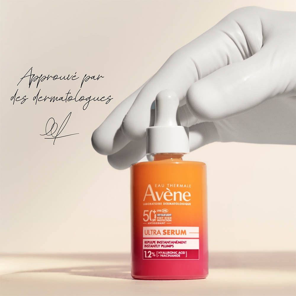 Flacon Avène Solaire Ultra Sérum SPF50+ avec sérum. Produit, texte, fond.