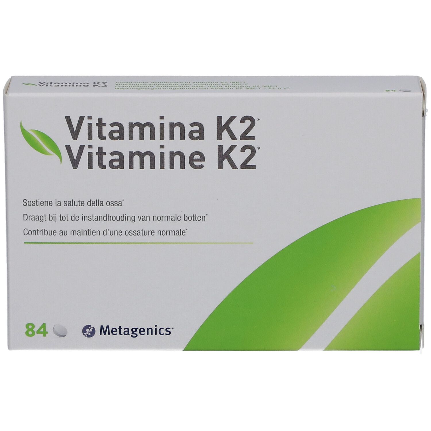 Boîte blanche avec "Vitamina K2". Contient 84 comprimés. Marque: Metagenics. Logo feuille verte.