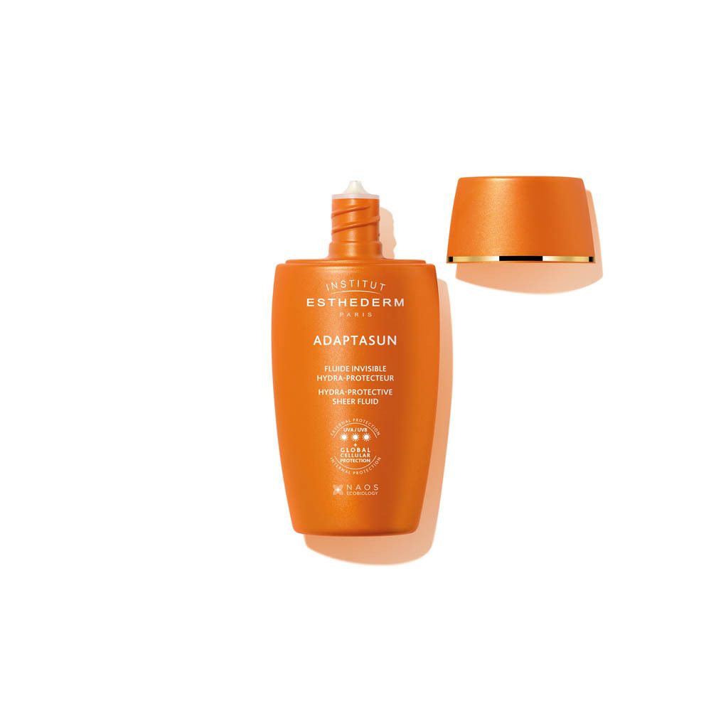 Oranje fles met open dop. Opschrift: Adaptasun, Fluide Invisible Hydra-Protecteur.