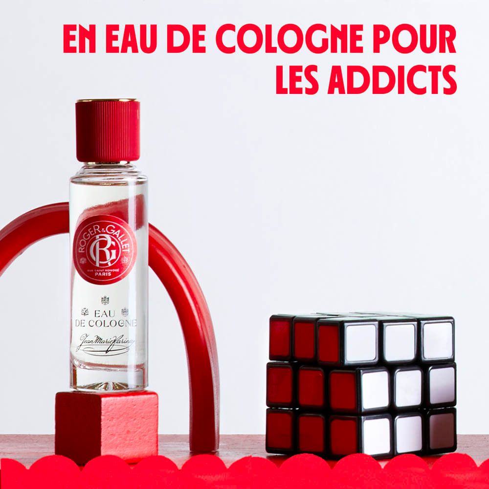 Flacon d'Eau de Cologne avec cube. Texte: En Eau de Cologne pour les Addicts.