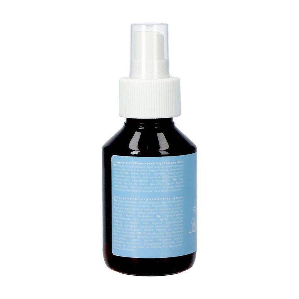 Flacon spray brun avec pompe blanche et étiquette bleue avec texte. Vue arrière.