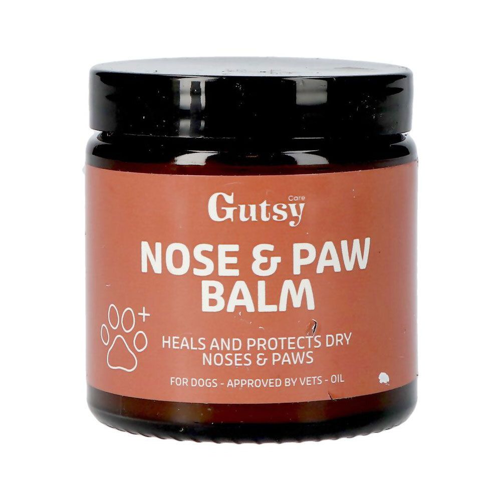 Pot brun avec couvercle noir. Inscription: Gutsy Nose & Paw Balm. Symbole de patte. Texte: Heals and protects dry noses & paws.
