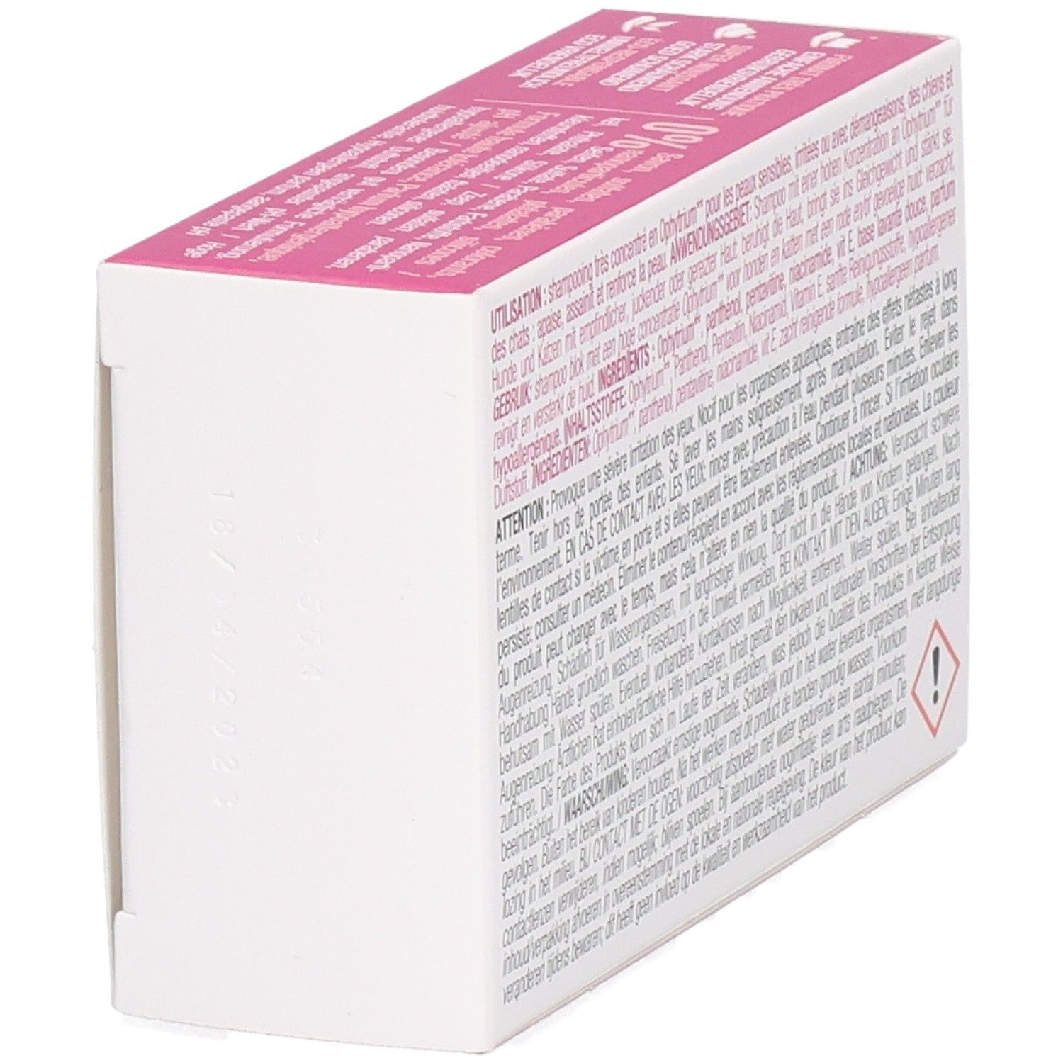 Vue latérale de la boîte. Boîte rose et blanche avec texte. Symbole d'avertissement.