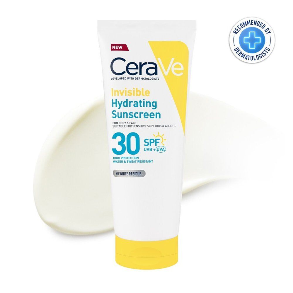 Tube blanc et jaune. Produit sur fond blanc avec une goutte de crème.