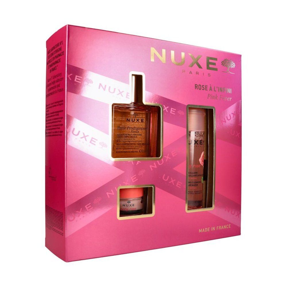 Zijkant van een roze Nuxe geschenkdoos met productinformatie.