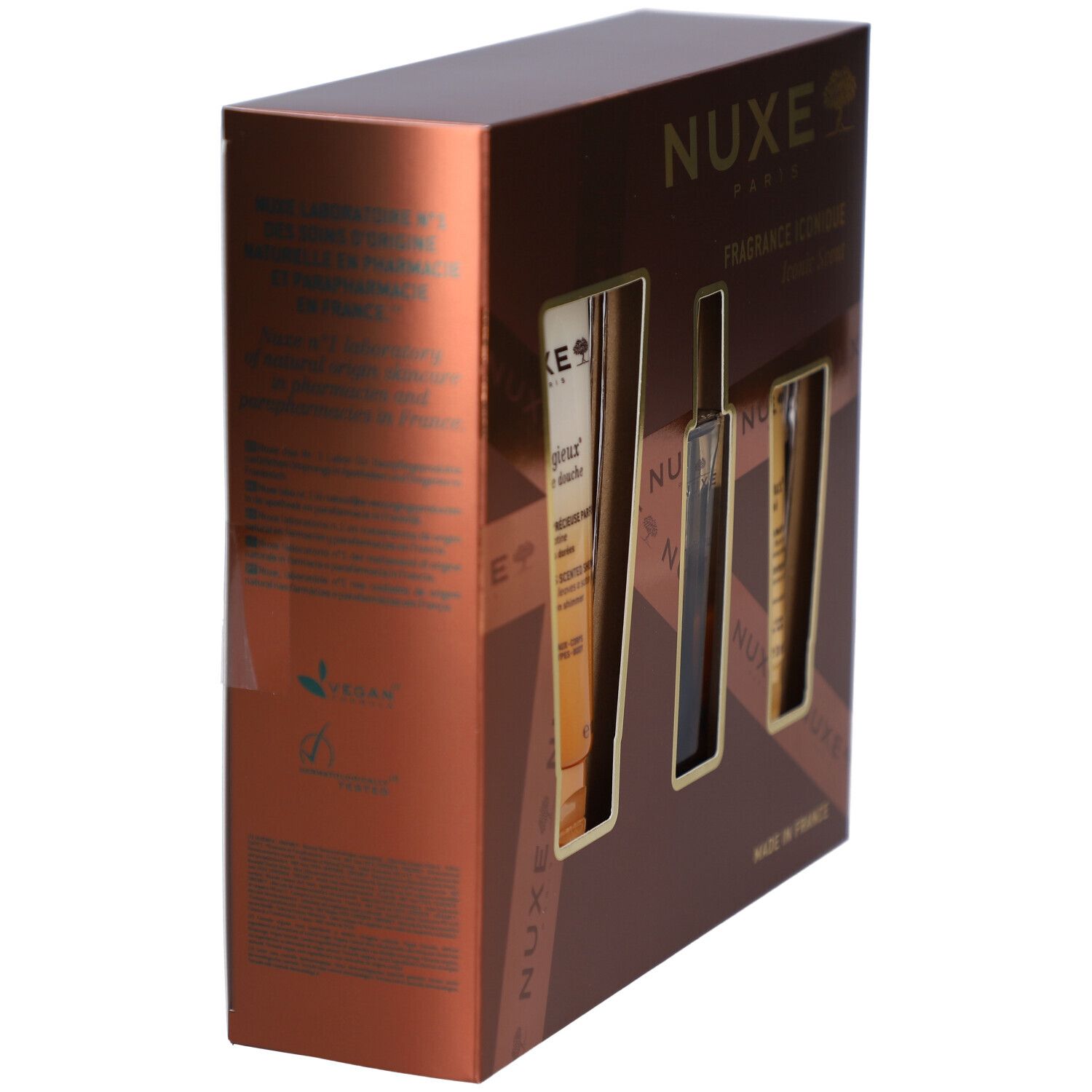 Bruine geschenkdoos met drie openingen. Bevat Nuxe producten. Zijaanzicht met tekst en logo. Made in France.