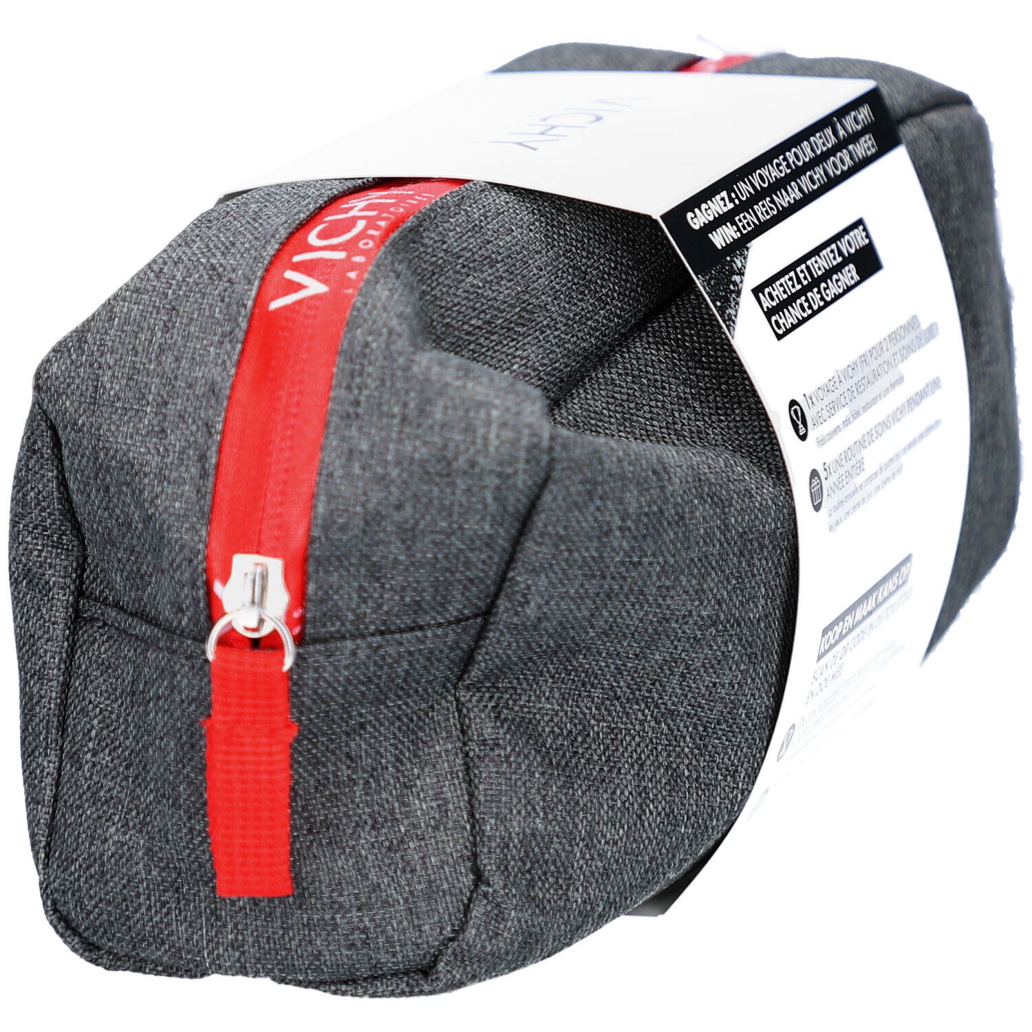 Trousse de toilette grise avec fermeture éclair rouge et logo Vichy. Emballage avec informations de concours.
