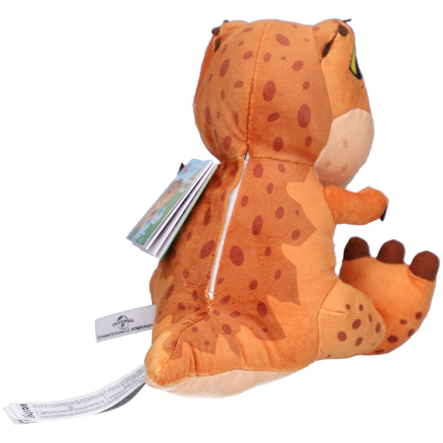 Achteraanzicht van een oranje T-Rex knuffel met rits. Een label is aan het product bevestigd.