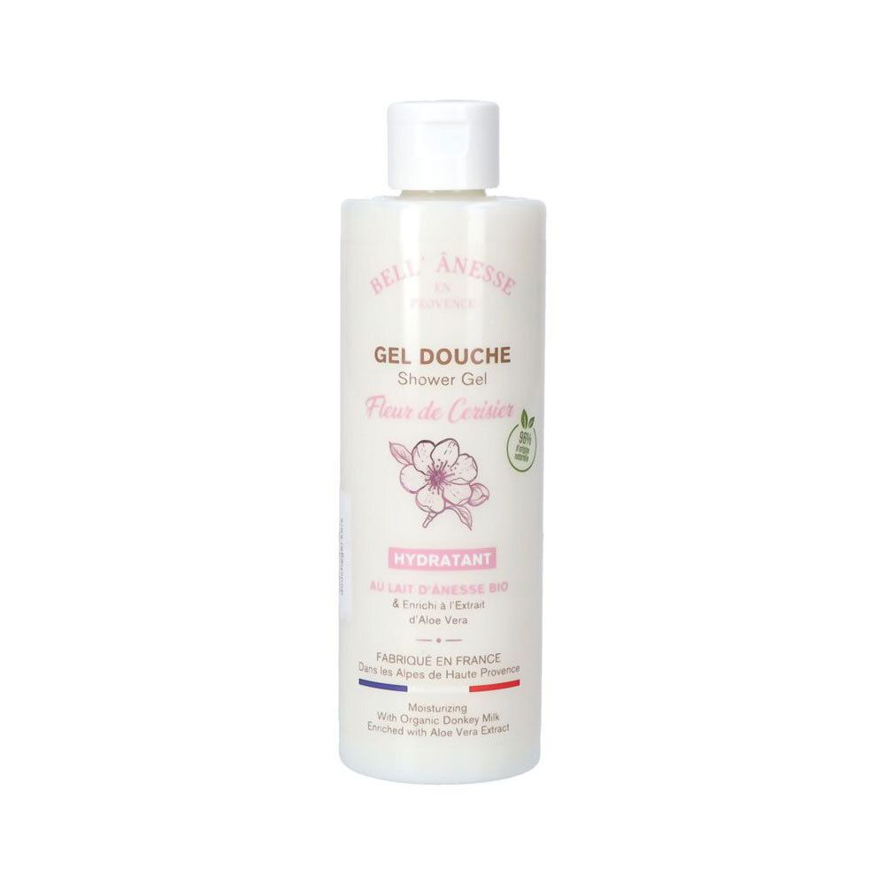 Flacon blanc avec bouchon blanc. Inscription: Gel Douche, Fleur de Cerisier. Motif fleur de cerisier rose.