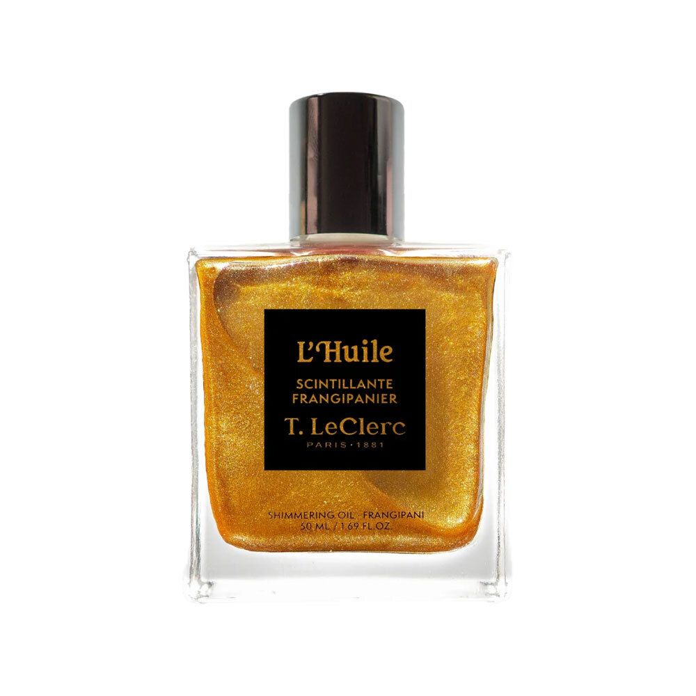 Vierkante glazen fles met zwarte dop. Zwart etiket met tekst: L'Huile Scintillante Frangipanier, T. LeClerc. Goudkleurige olie.
