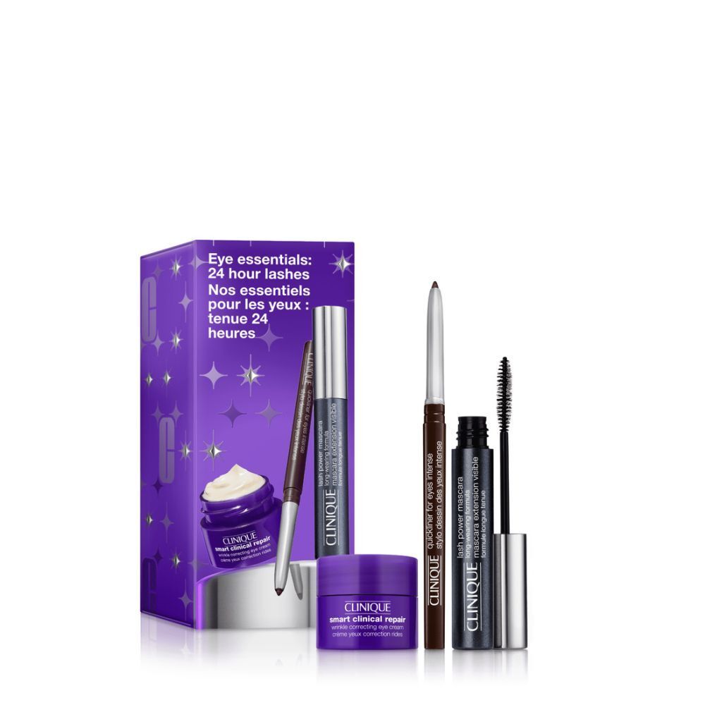 Coffret Clinique Eye Essential. Contient mascara, eyeliner et crème pour les yeux. Emballage violet avec nom du produit. Étoiles décoratives.