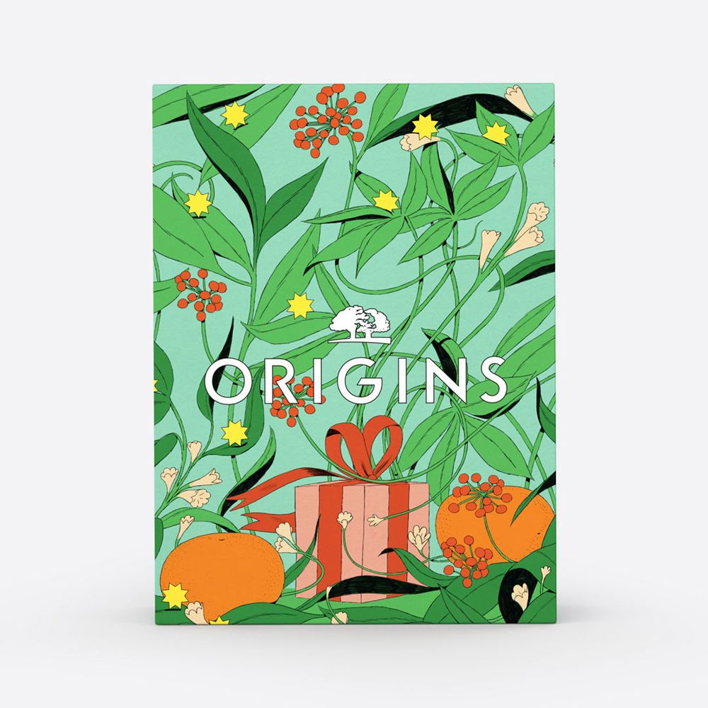 Coffret cadeau avec un design floral et l'inscription "ORIGINS". La boîte est verte et représente un cadeau.