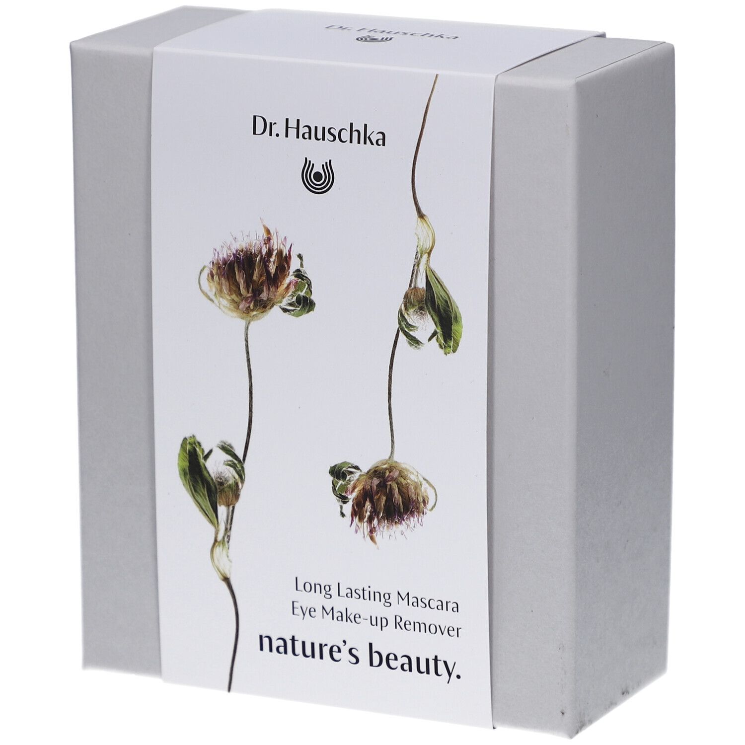 Witte doos met bloemenontwerp en productnamen. Opschrift: Dr. Hauschka, Long Lasting Mascara, Eye Make-up Remover, nature's beauty.