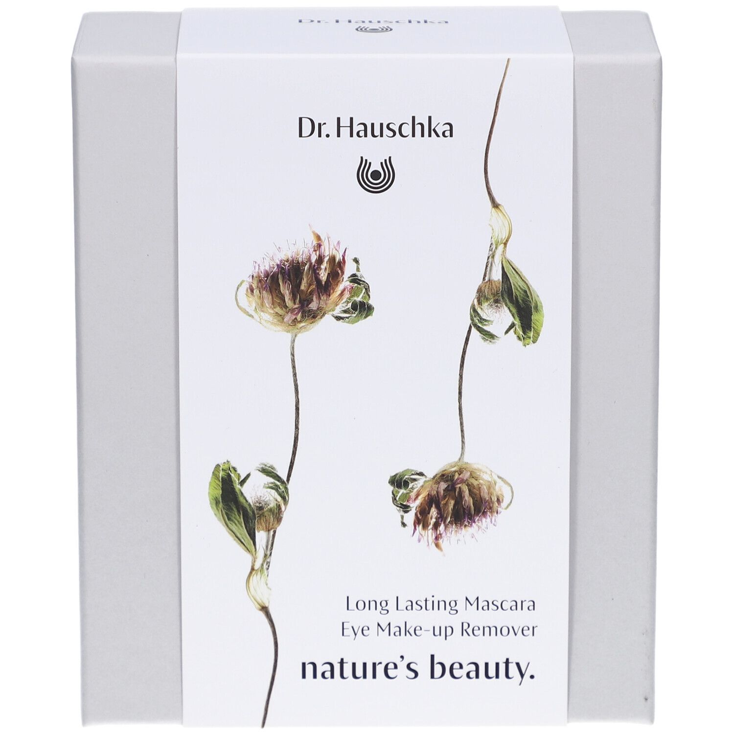 Witte doos met bloemenontwerp en productnamen. Opschrift: Dr. Hauschka, Long Lasting Mascara, Eye Make-up Remover, nature's beauty.