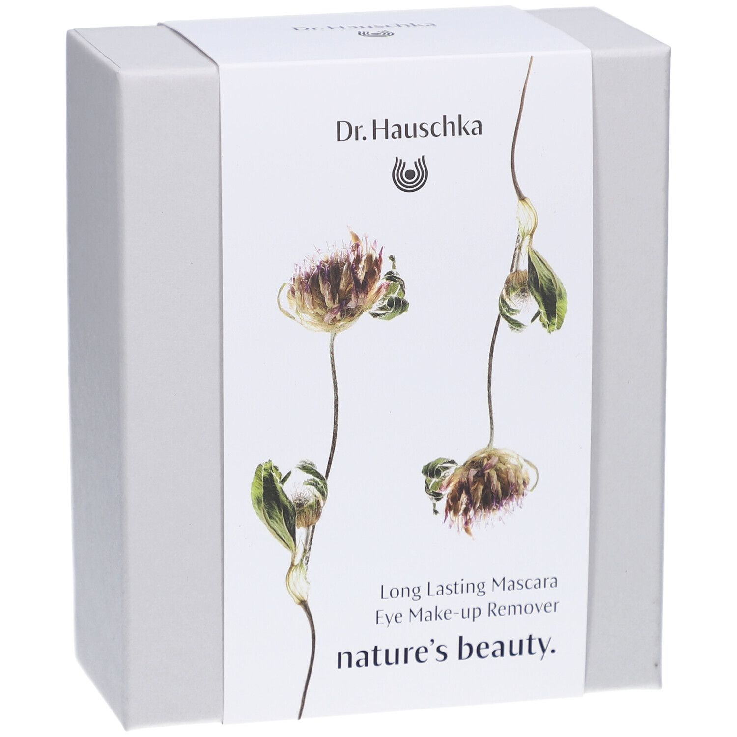 Witte doos met bloemenontwerp en productnamen. Opschrift: Dr. Hauschka, Long Lasting Mascara, Eye Make-up Remover, nature's beauty.