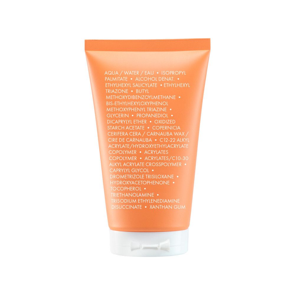 Dos du tube de lait solaire. Ingrédients. Fond blanc.