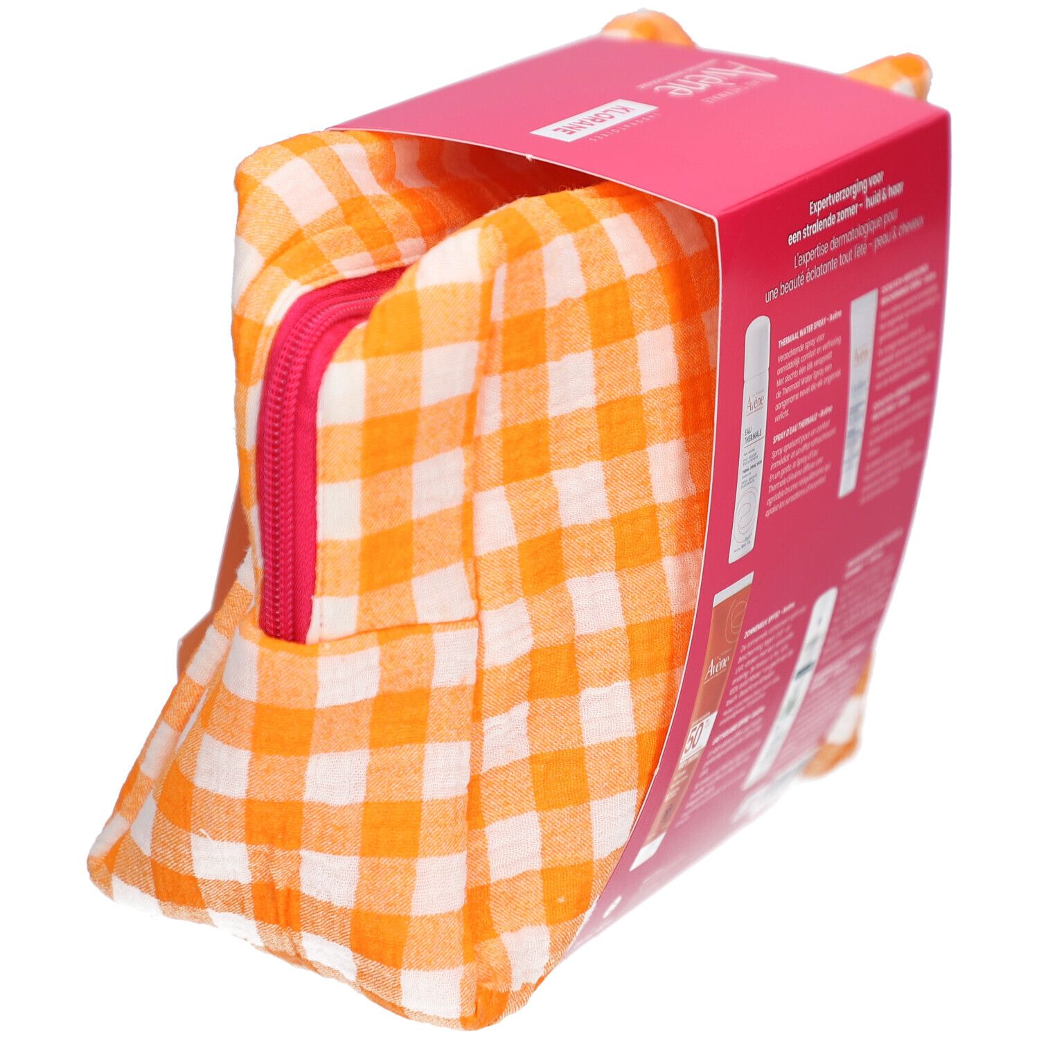 Geschenkverpakking gedeeltelijk geopend. Oranje tas met rits. Roze doos met productinformatie.