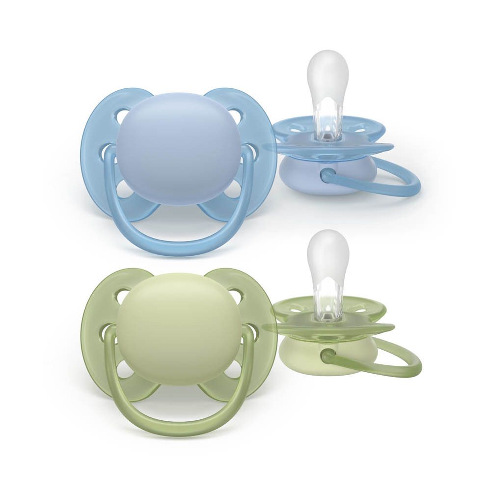 Twee Philips Avent fopspenen, lichtblauw en groen, in een doorzichtige bewaarkoffer.
