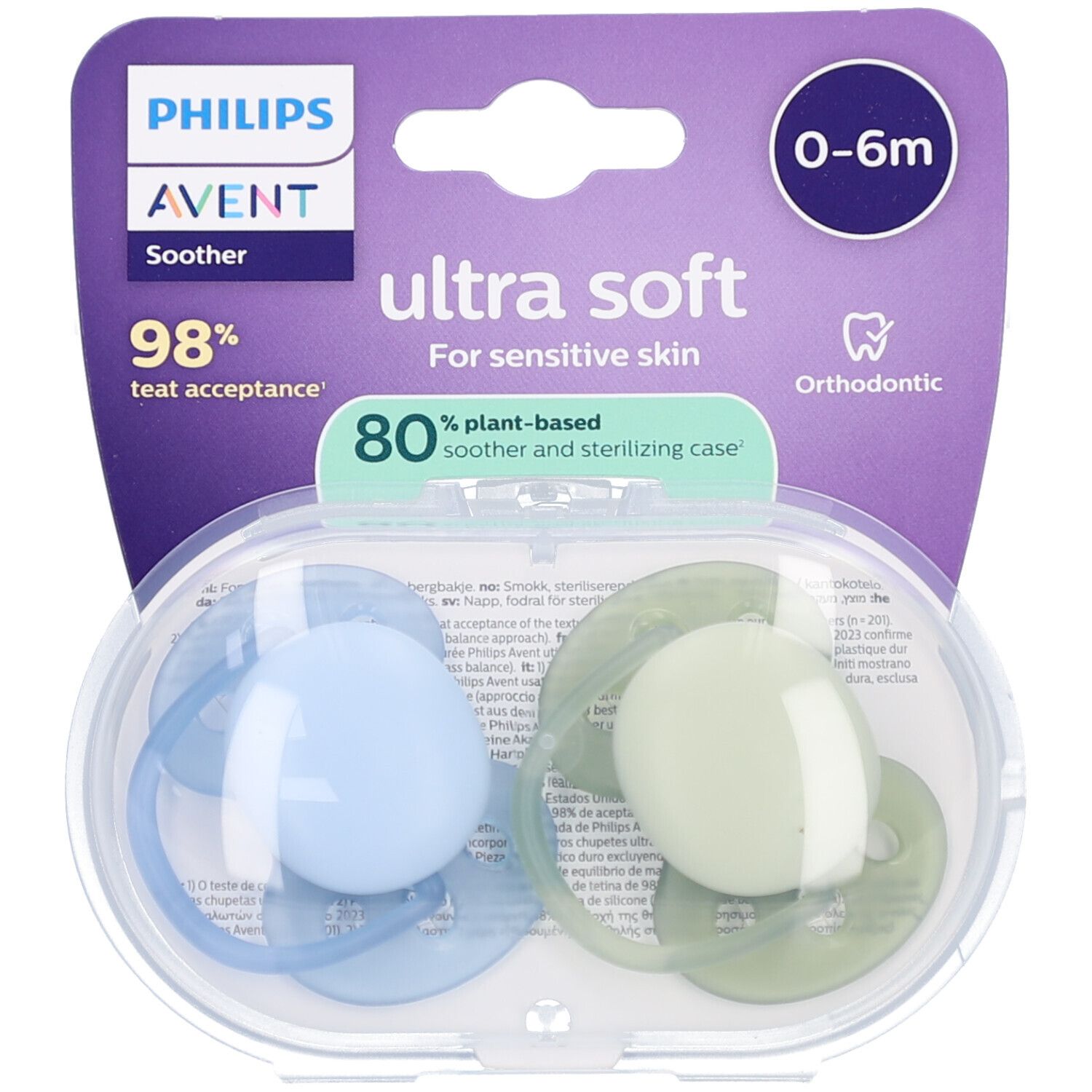 Twee fopspenen in een transparante verpakking. Lichtblauw en groen. Verpakking met logo en productinfo.