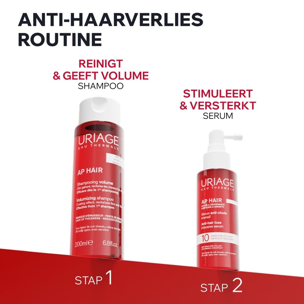 Twee rode Uriage flacons: shampoo (200ml) en serum met applicator. Anti-haarverlies routine.