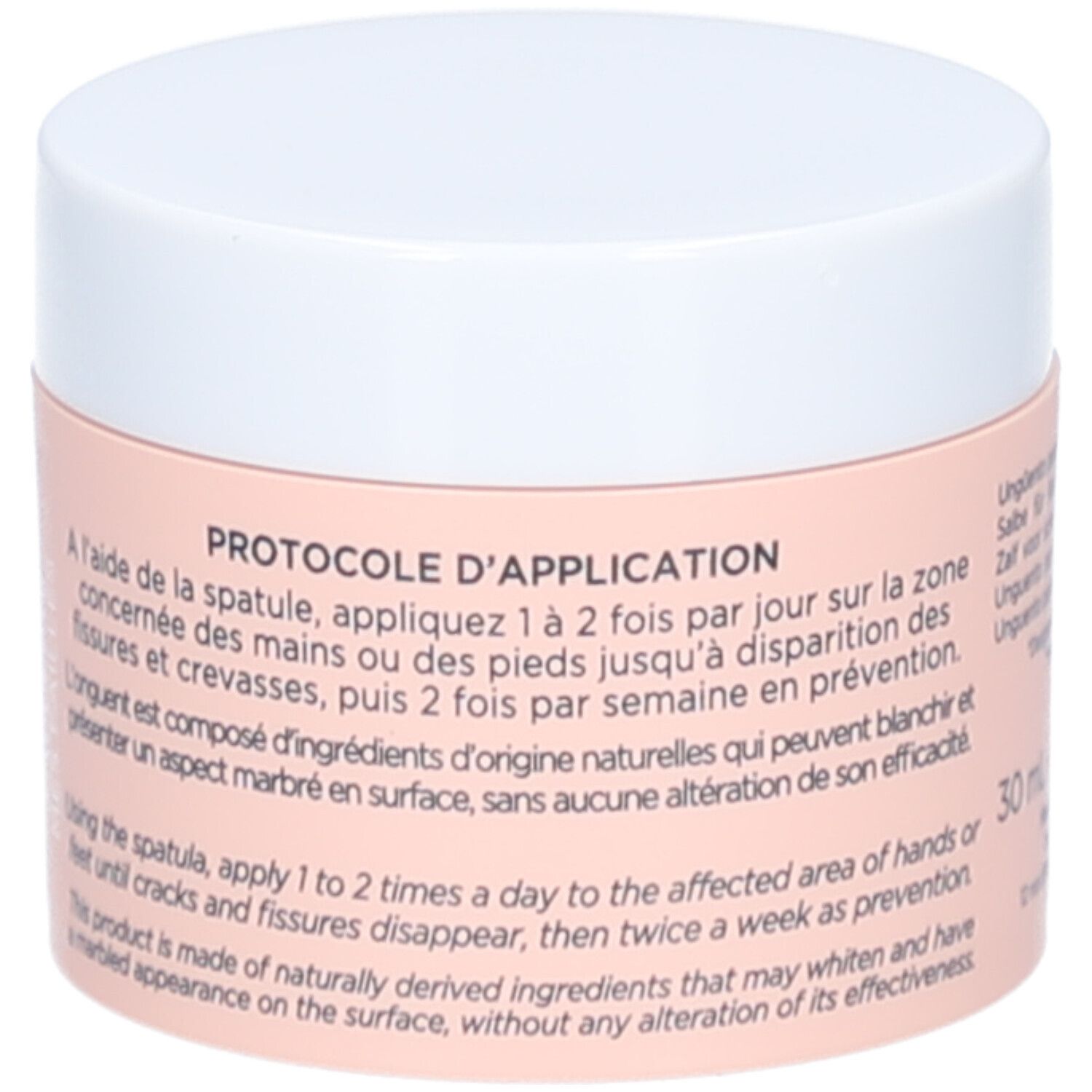 Pot de crème, couvercle blanc. Inscription: L'ONGUENT FISSURES & CREVASSES. Instructions d'utilisation au dos. 30 ml.