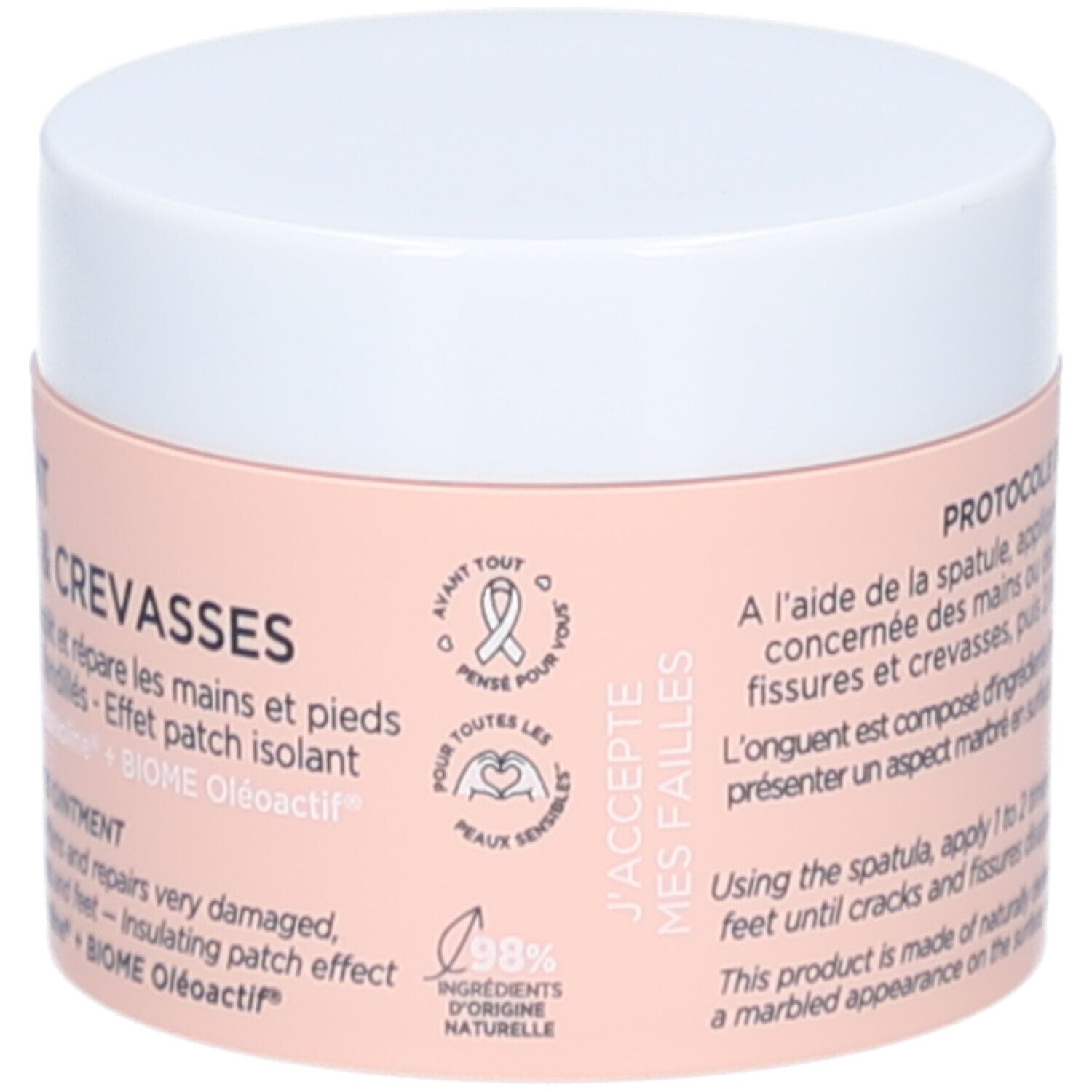 Pot de crème, couvercle blanc. Inscription: L'ONGUENT FISSURES & CREVASSES. Étiquette avec logo et texte. 98% ingrédients naturels.