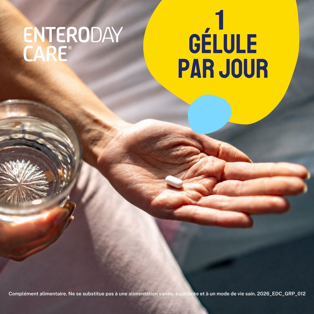 Main tenant une gélule et un verre d'eau. Inscription: 1 gélule par jour.