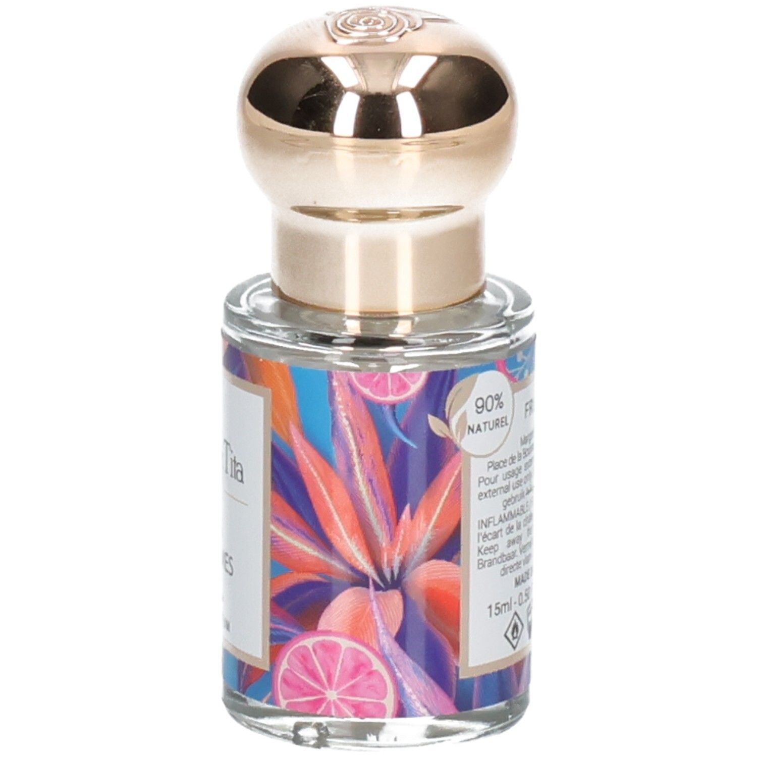 Flacon de parfum avec bouchon doré et étiquette colorée aux agrumes et feuilles tropicales. Contient 15ml.