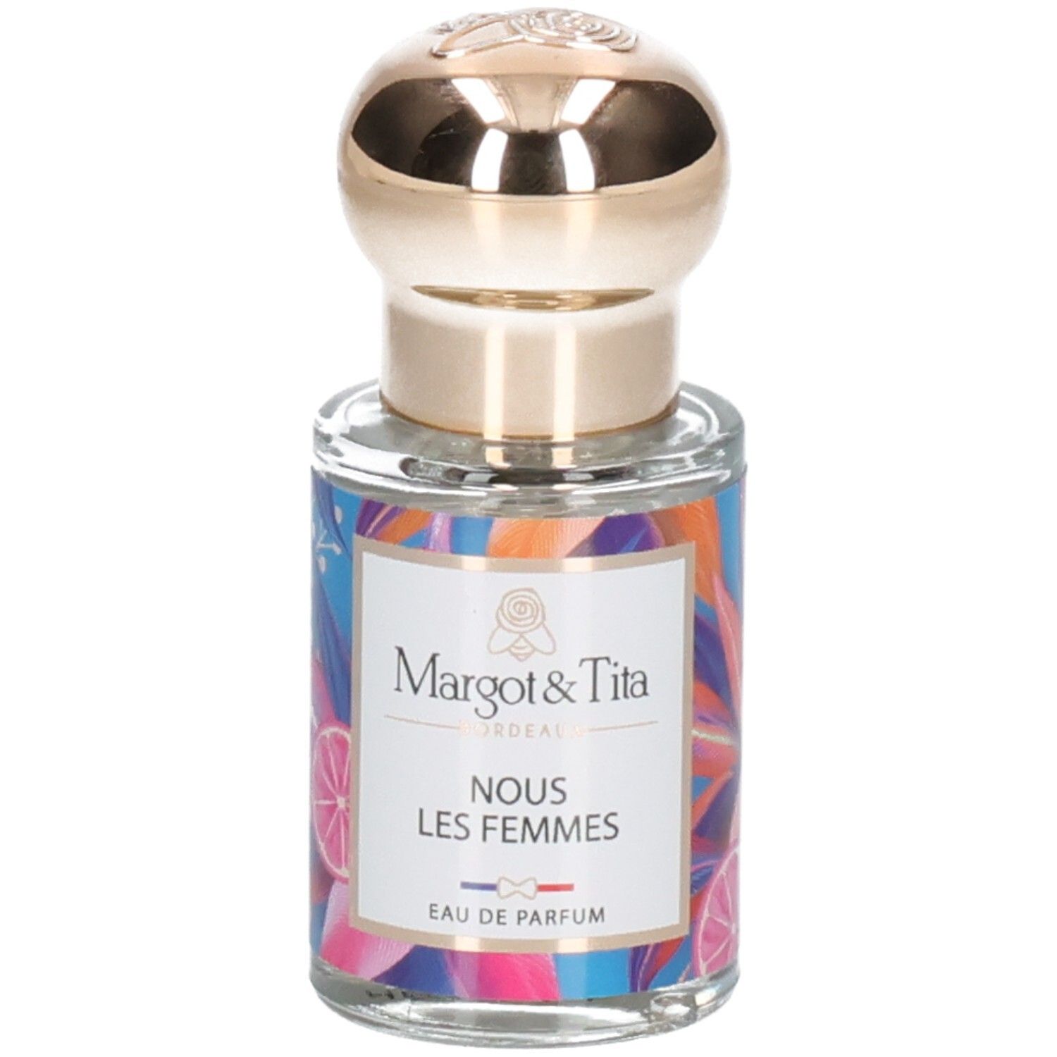 Flacon de parfum avec bouchon doré et étiquette colorée 'Margot & Tita NOUS LES FEMMES EAU DE PARFUM'.