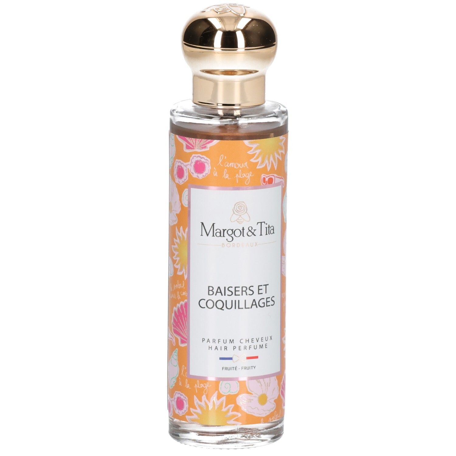 Haarparfum in glazen fles met gouden dop. Oranje label met schelpen en bloemen.