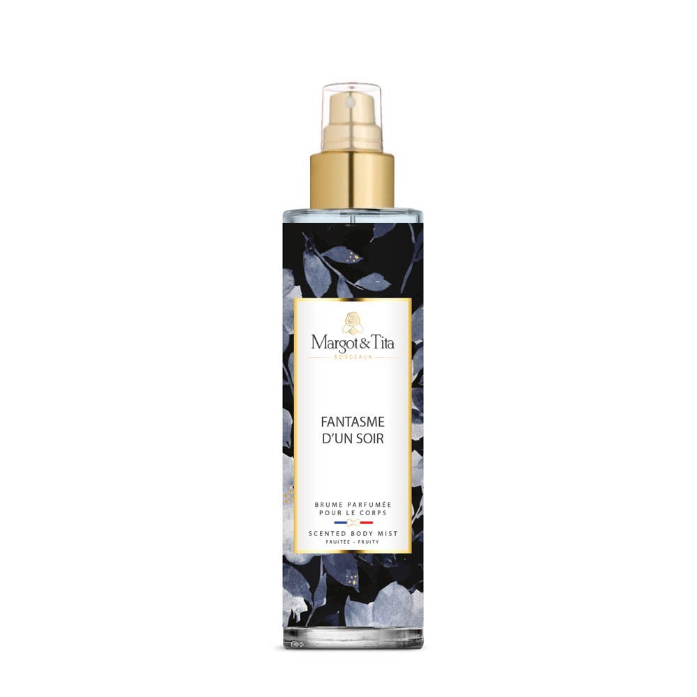 Margot & Tita Fantasme Un Soir Bodyspray, 200ml. Transparante fles met bloemenpatroon en gouden spuitkop.