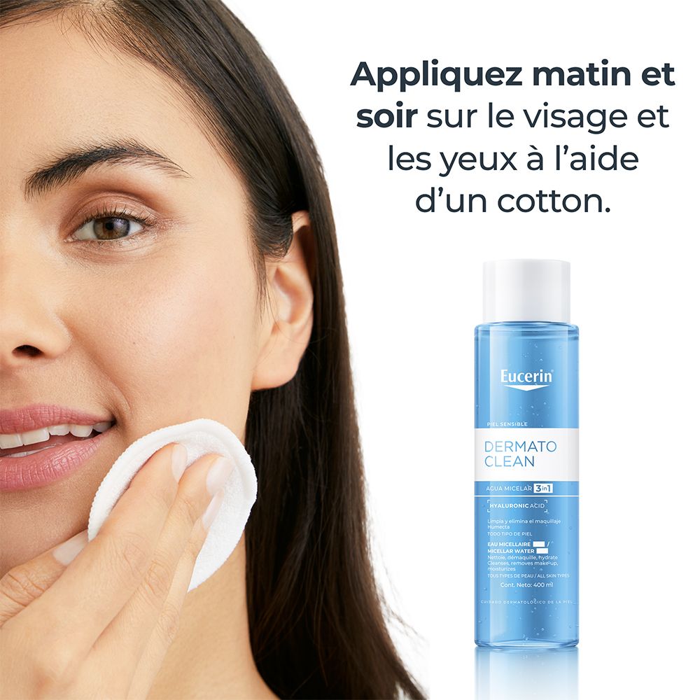 Femme se nettoyant le visage avec un coton et Eucerin DermatoCLEAN Micellar Water 3 en 1.
